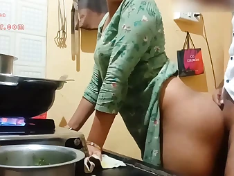See this Indian Milf with a ample bum get down and sloppy in the kitchen